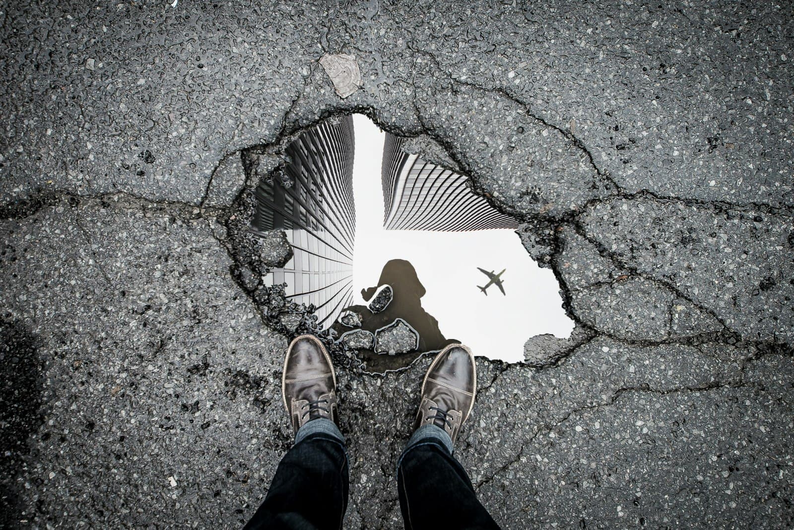 Cracked asphalt marked for repair, the kind of damage CraftWell Group fixes in London Ontario