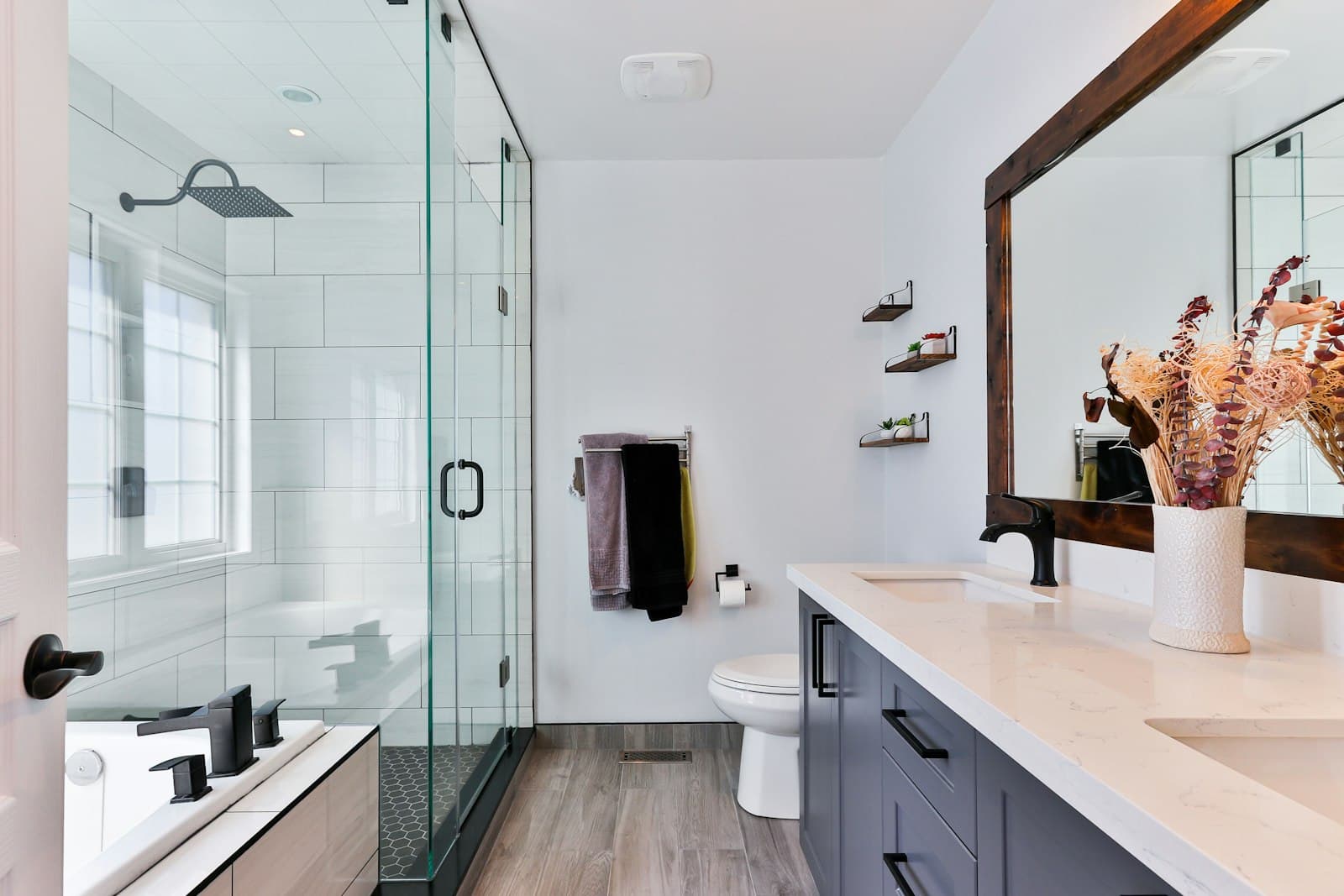 Modern renovated bathroom with glass shower, CraftWell Group London Ontario
